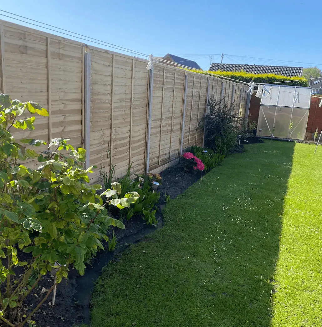 new fence with concrete posts and gravel boards