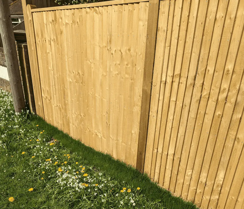 new fence with wooden posts